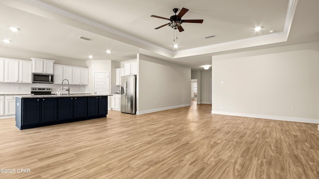 4744 Rosemary St, Panama City, FL 32404 - interior space with stainless steel appliances, open floor plan, backsplash, ceiling fan, and a raised ceiling