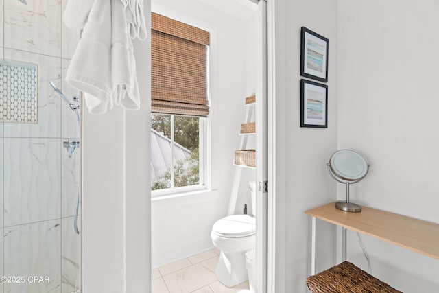 full bath featuring toilet, baseboards, a marble finish shower, and marble finish floor