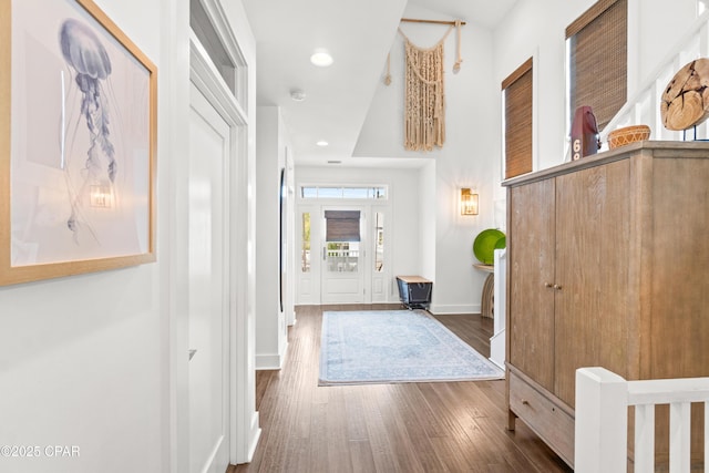 entryway with baseboards, recessed lighting, and dark wood finished floors