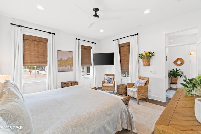 bedroom featuring baseboards, a ceiling fan, recessed lighting, and wood finished floors