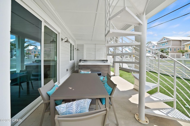 exterior space featuring a hot tub and a residential view
