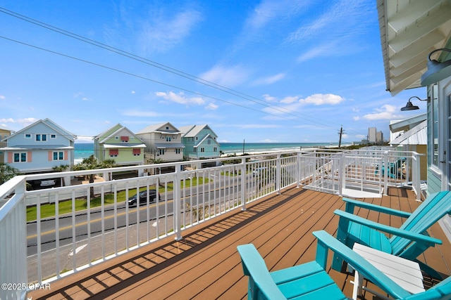wooden terrace with a water view
