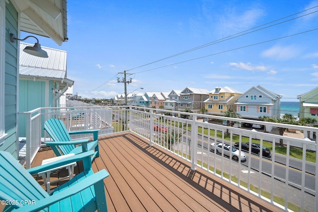 wooden terrace with a residential view