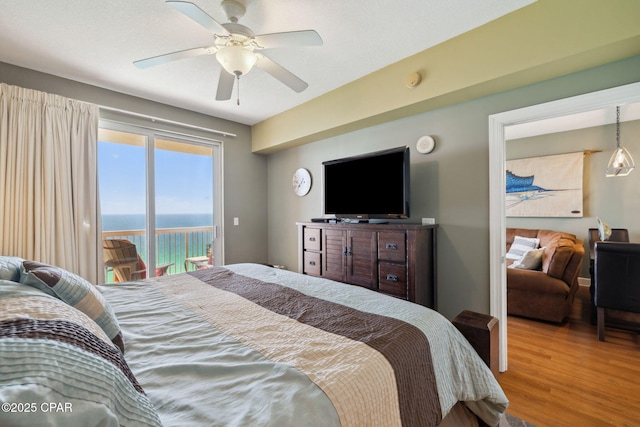 14825 Front Beach Rd Unit 2205, Panama City Beach, FL 32413 - bedroom featuring a ceiling fan, wood finished floors, and access to exterior