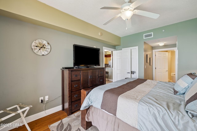 14825 Front Beach Rd Unit 2205, Panama City Beach, FL 32413 - bedroom featuring baseboards, a ceiling fan, visible vents, and wood finished floors