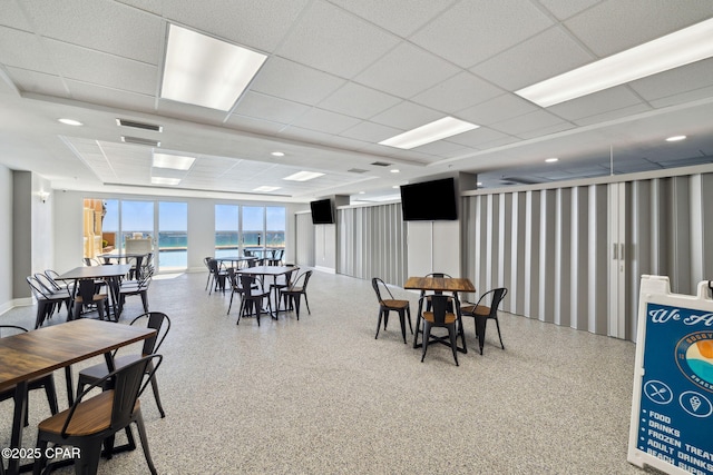 14825 Front Beach Rd Unit 2205, Panama City Beach, FL 32413 - dining room featuring speckled floor, visible vents, and a paneled ceiling