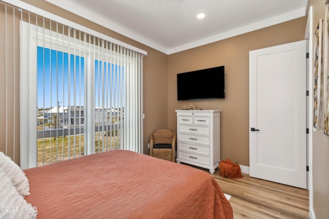 bedroom featuring recessed lighting, light wood-style flooring, access to exterior, and baseboards