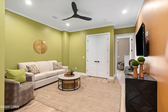 living room with ceiling fan, wood finished floors, visible vents, and recessed lighting