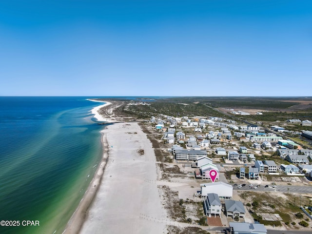 bird's eye view featuring a beach view and a water view