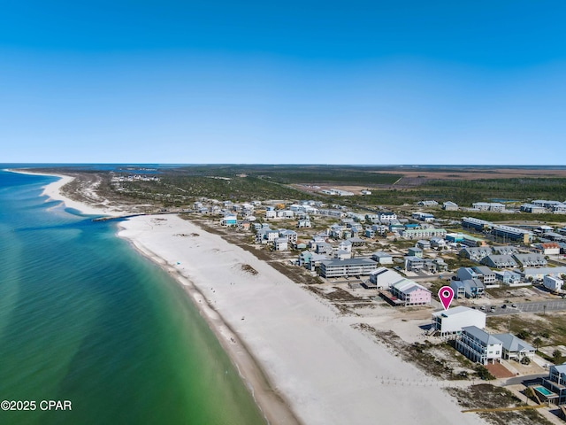 drone / aerial view featuring a view of the beach and a water view