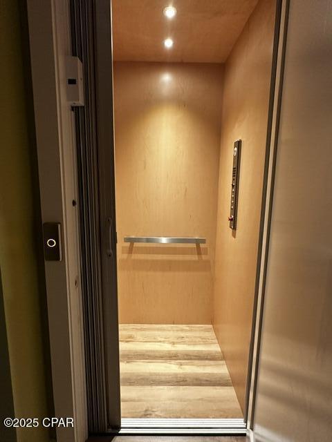 room details featuring recessed lighting and elevator