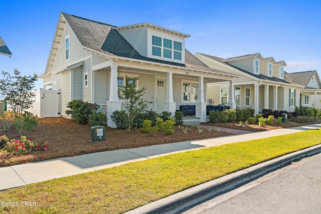 2121 Sedges Ave, Panama City, FL 32405 - view of front facade featuring a gate, a porch, and a shingled roof