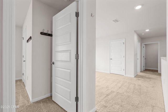 hallway with baseboards, carpet, recessed lighting, and visible vents
