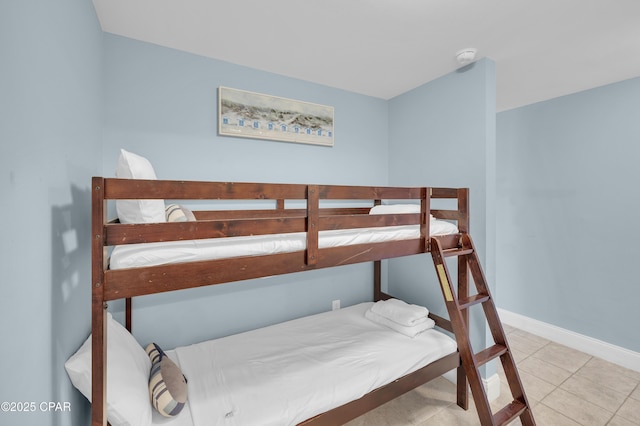 tiled bedroom with baseboards