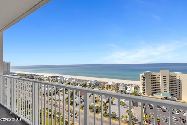 balcony with a view of the beach and a water view