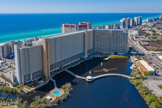 birds eye view of property with a city view and a water view
