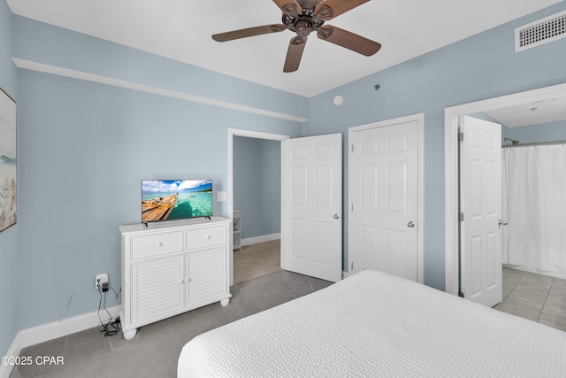 bedroom featuring baseboards, a ceiling fan, and visible vents