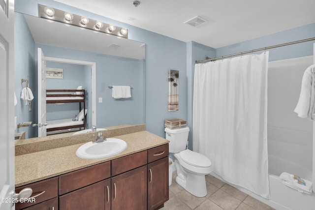bathroom with tile patterned floors, connected bathroom, vanity, toilet, and visible vents