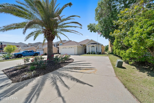 view of front facade featuring concrete driveway and a garage