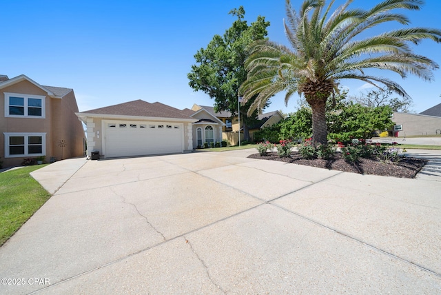 view of front of home with driveway and a garage