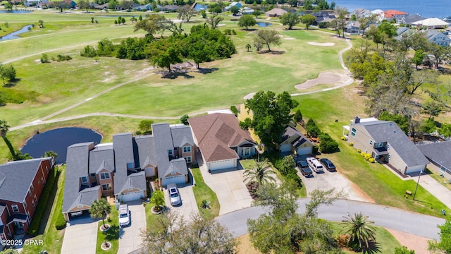 birds eye view of property with a residential view, a water view, and view of golf course