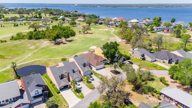 birds eye view of property featuring a residential view, view of golf course, and a water view
