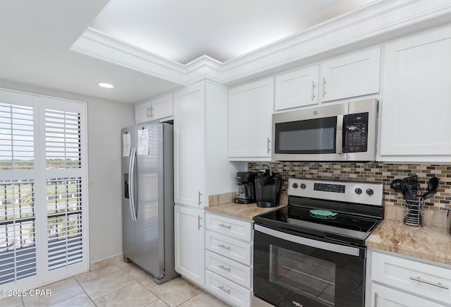11619 Front Bch Unit 610, Panama City Beach, FL 32407 - kitchen featuring appliances with stainless steel finishes, tasteful backsplash, light countertops, white cabinetry, and light tile patterned floors