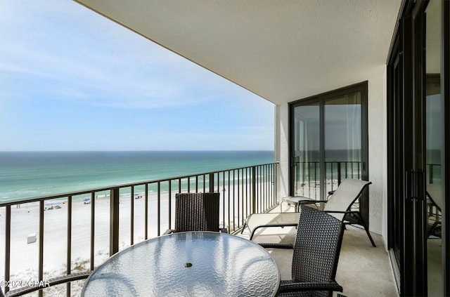 11619 Front Bch Unit 610, Panama City Beach, FL 32407 - balcony featuring view of water and beach and outdoor dining space