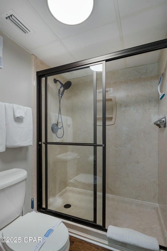11619 Front Bch Unit 610, Panama City Beach, FL 32407 - bathroom with a shower stall and wood finished floors
