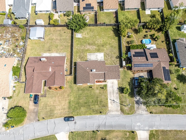 birds eye view of property with a residential view