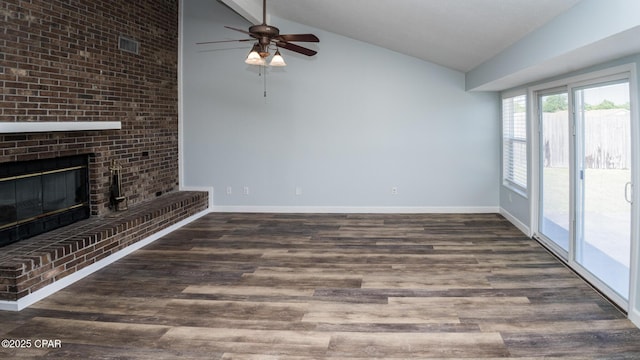 unfurnished living room with wood finished floors, ceiling fan, a fireplace, baseboards, and visible vents