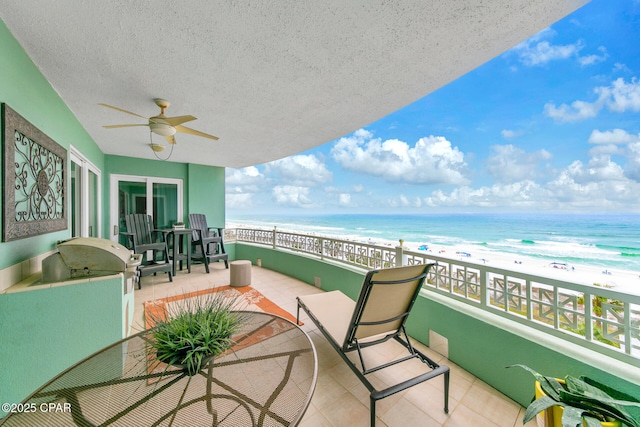 7505 Thomas Dr Unit 512B, Panama City, FL 32408 - balcony with view of water and beach and ceiling fan