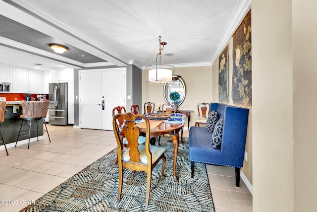 7505 Thomas Dr Unit 512B, Panama City, FL 32408 - dining area featuring light tile patterned floors, ornamental molding, and baseboards
