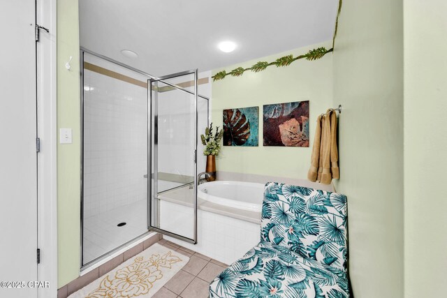 7505 Thomas Dr Unit 512B, Panama City, FL 32408 - full bathroom with a shower stall, tile patterned floors, and a bath
