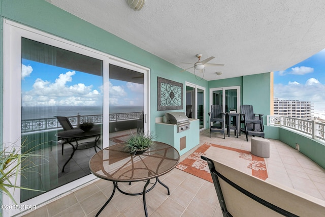 7505 Thomas Dr Unit 512B, Panama City, FL 32408 - balcony featuring exterior kitchen, ceiling fan, and area for grilling