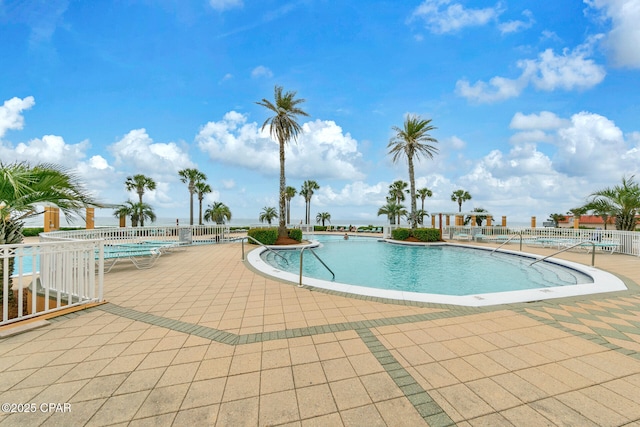 7505 Thomas Dr Unit 512B, Panama City, FL 32408 - community pool with a patio area and fence