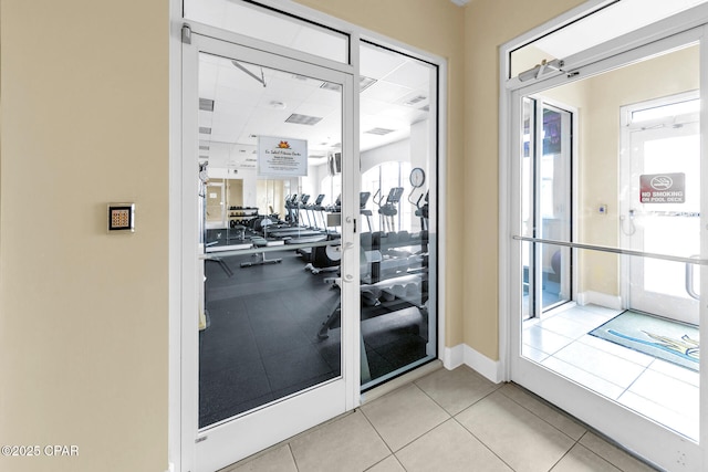 7505 Thomas Dr Unit 512B, Panama City, FL 32408 - doorway featuring baseboards and light tile patterned floors