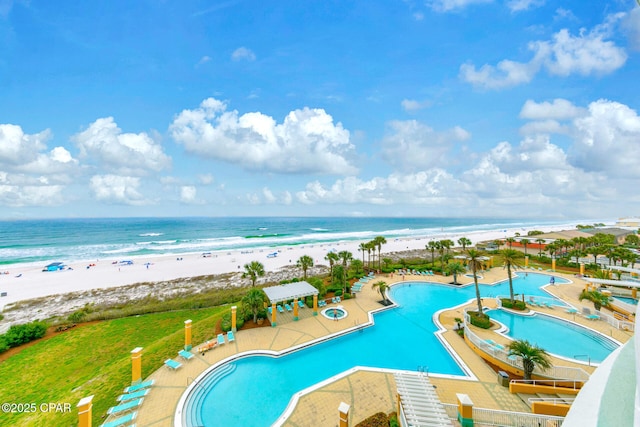7505 Thomas Dr Unit 512B, Panama City, FL 32408 - community pool with view of water and beach and a patio area