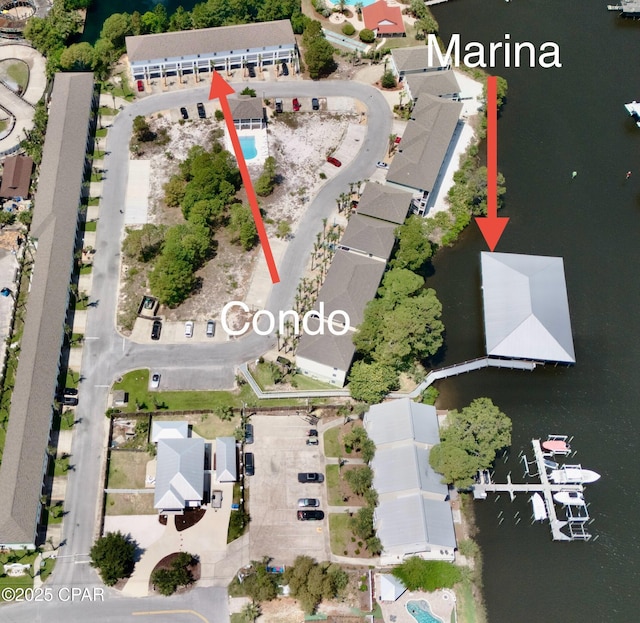 aerial view with a residential view and a water view