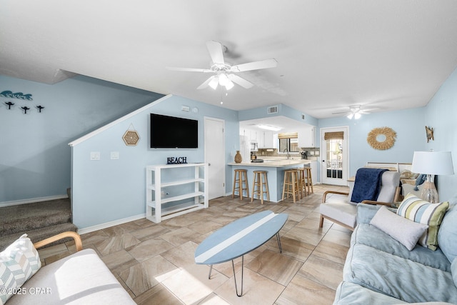 171 Damon Cir, Panama City Beach, FL 32407 - living room featuring a ceiling fan and baseboards