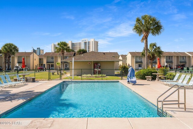 171 Damon Cir, Panama City Beach, FL 32407 - community pool featuring a residential view, a patio, and fence