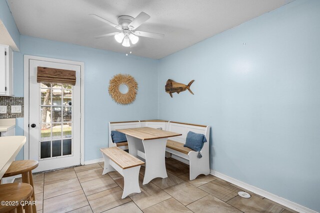 171 Damon Cir, Panama City Beach, FL 32407 - dining area with ceiling fan, baseboards, and light tile patterned flooring