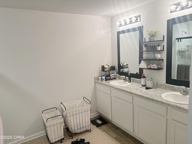 full bathroom with double vanity and a sink