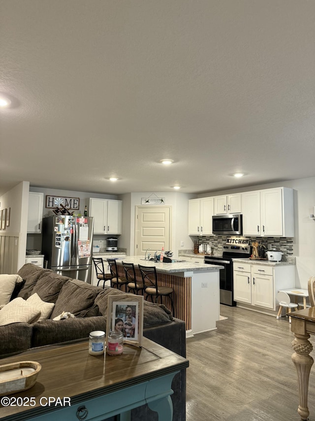 living area featuring recessed lighting and wood finished floors
