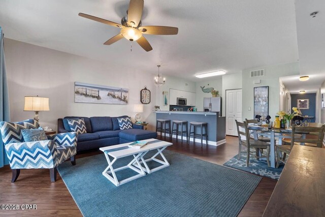 9900 S Thomas Dr Unit 819, Panama City Beach, FL 32408 - living area featuring a ceiling fan, visible vents, and dark wood finished floors