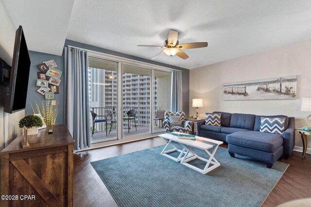 9900 S Thomas Dr Unit 819, Panama City Beach, FL 32408 - living area with a ceiling fan and wood finished floors