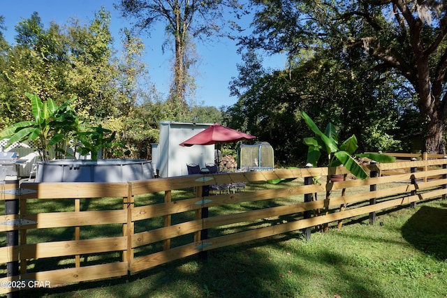 view of gate with fence