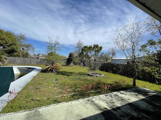 view of yard with a fenced backyard
