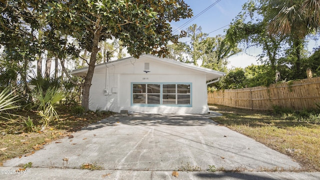 rear view of property with fence