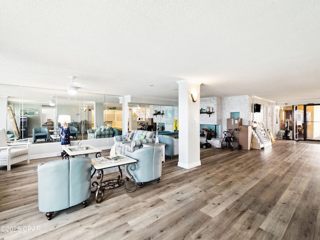 5801 Thomas Dr Unit 415, Panama City, FL 32408 - living room featuring a textured ceiling and light wood finished floors